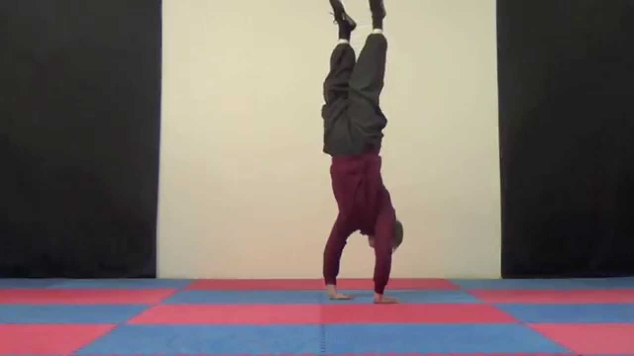 Norwich Yoga teacher shows handstands