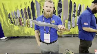 Tops Knives booth at Blade Show 2023 shopping for a friend and prototypes