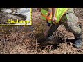 Unclogging Culvert To Drain Back Flooding Road