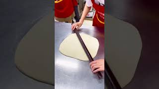 Using stick to roll dough Using stick to roll dough
