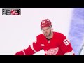 Alex DeBrincat scores a goal against the New Jersey Devils