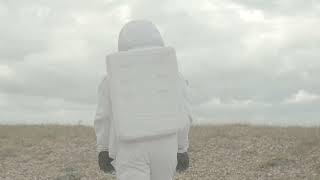 Alone man wearing astronaut costume and walking - Copyright Free Video