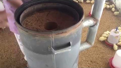 Brooder  heating lamp runs on saw dust