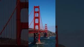 Blue Waters With Red Suspension Bridge - Copyright Free Footage.