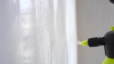 Priming the Wall Surface with an Atomizer Close-up in Slow Motion | Stock Footage - Videohive