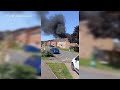 Huge plumes of black smoke spotted after garage fire spreads to homes near schools