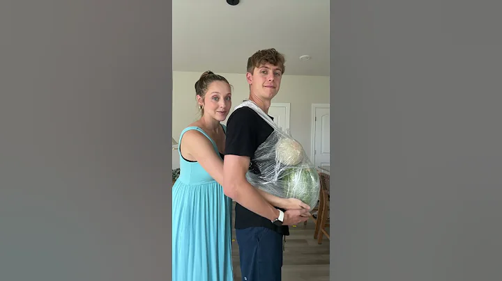 Lifting up my pregnant husband's belly