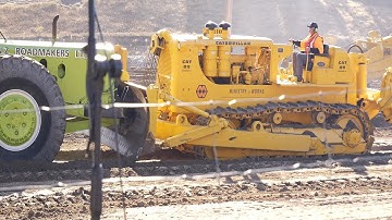 Caterpillar D9 Series E Bulldozer pushing a Euclid 16TDT Motor Scraper at Wheels at Wanaka 2023