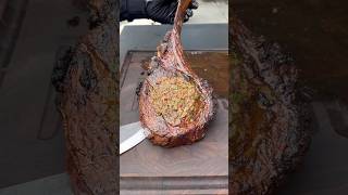 Smoked tomahawk steak with bacon and herb compound butter