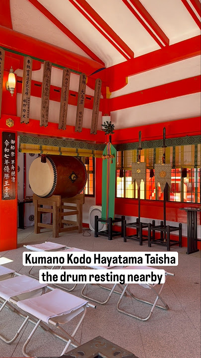 At Kumano Hayatama Taisha, I paused beneath the massive sacred rope by the altar, the drum nearby