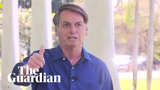 Bolsonaro removes mask after positive Covid-19 test to show press 'I'm doing well'