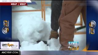 Michigan Tech students completing Winter Carnival snow statues