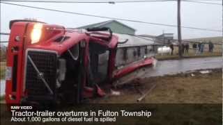 Tractor-trailer overturns, spills 1,000 gallons of diesel fuel
