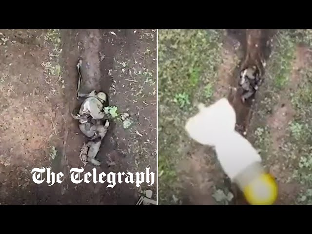 Moment Russian soldier catches and throws away Ukrainian 'drone bombs' class=