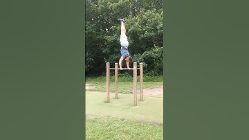 Press to Handstand on Parallel bars.