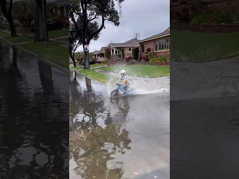 Baby Plays In The Summer Rain