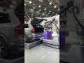 Robots loading boxes in the trunk