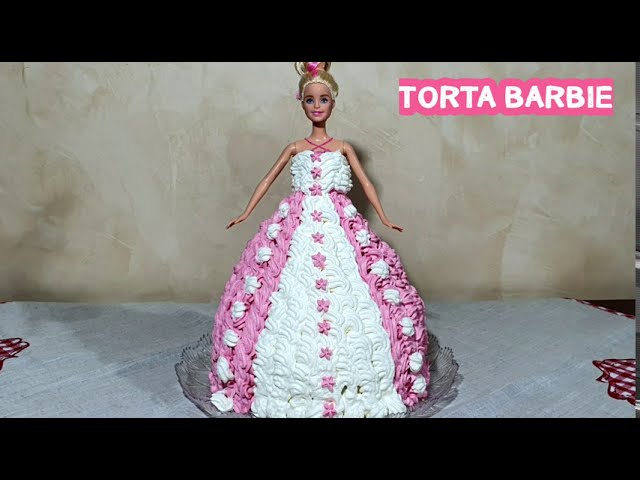 Una torta per bambole barbie fatta di glassa rosa nello stile di una  coreografia comica