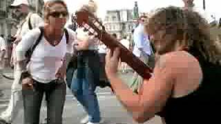 Paris Guitarist Gets a Lady Dancing and Singing