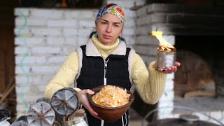 The Woman lives in village. Cooking Ukrainian cabbage Soup. She makes trench candles for army