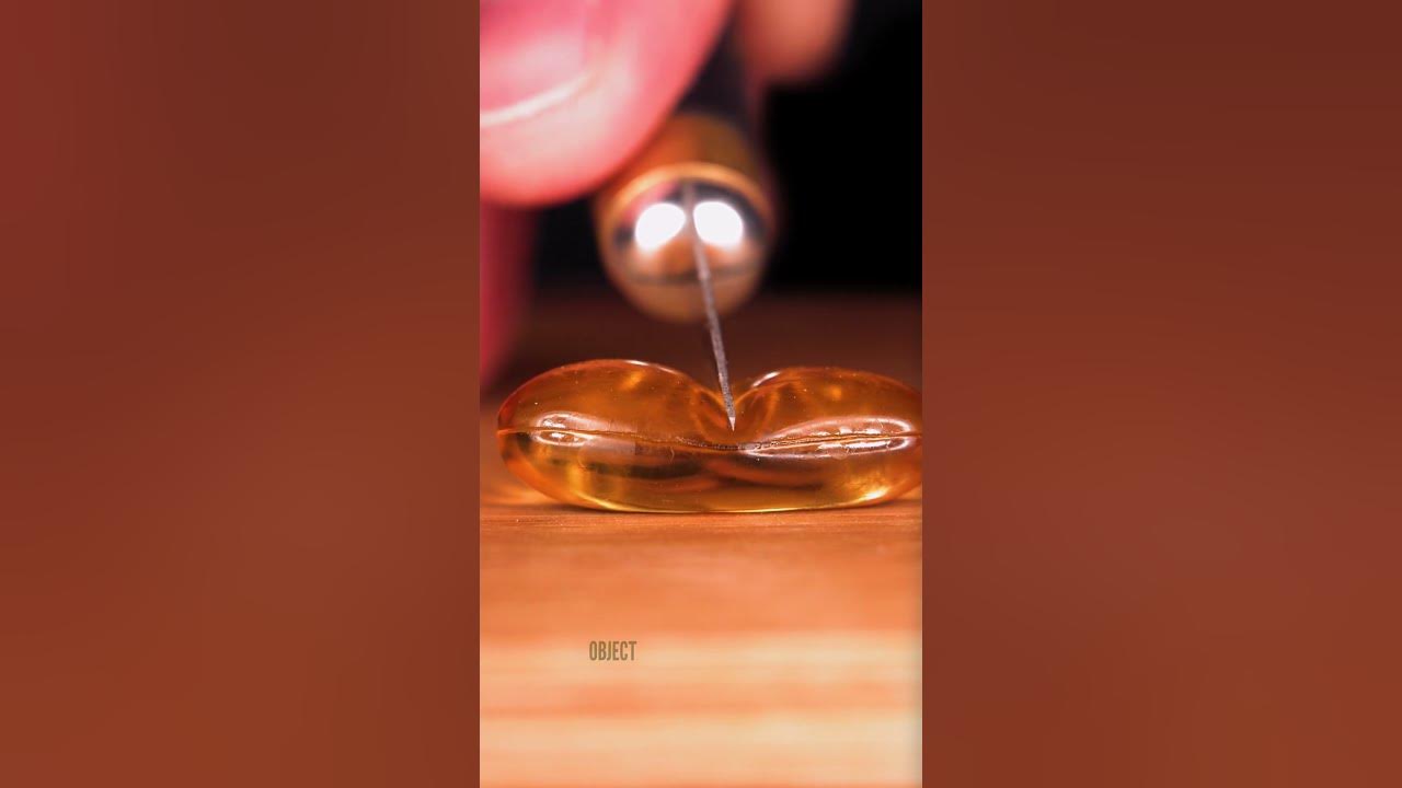 Cutting a Softgel Close-up | Original sounds created by @OddioStudio Follow this Foley artist!