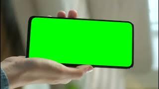 Hand showing a cellphone Green Screen