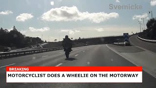 Motorcyclist does a wheelie on the motorway