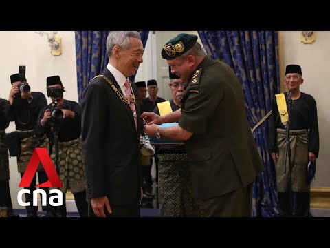 PM Lee, Ho Ching receive awards from Johor Sultan
