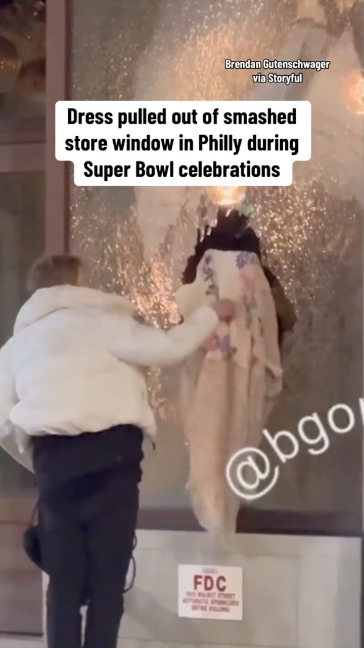 Dress pulled out of smashed store window in Philly during Super Bowl celebrations #shorts