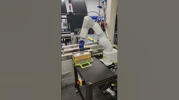 Conflex CWM160 with Epson 6 axis robot loader