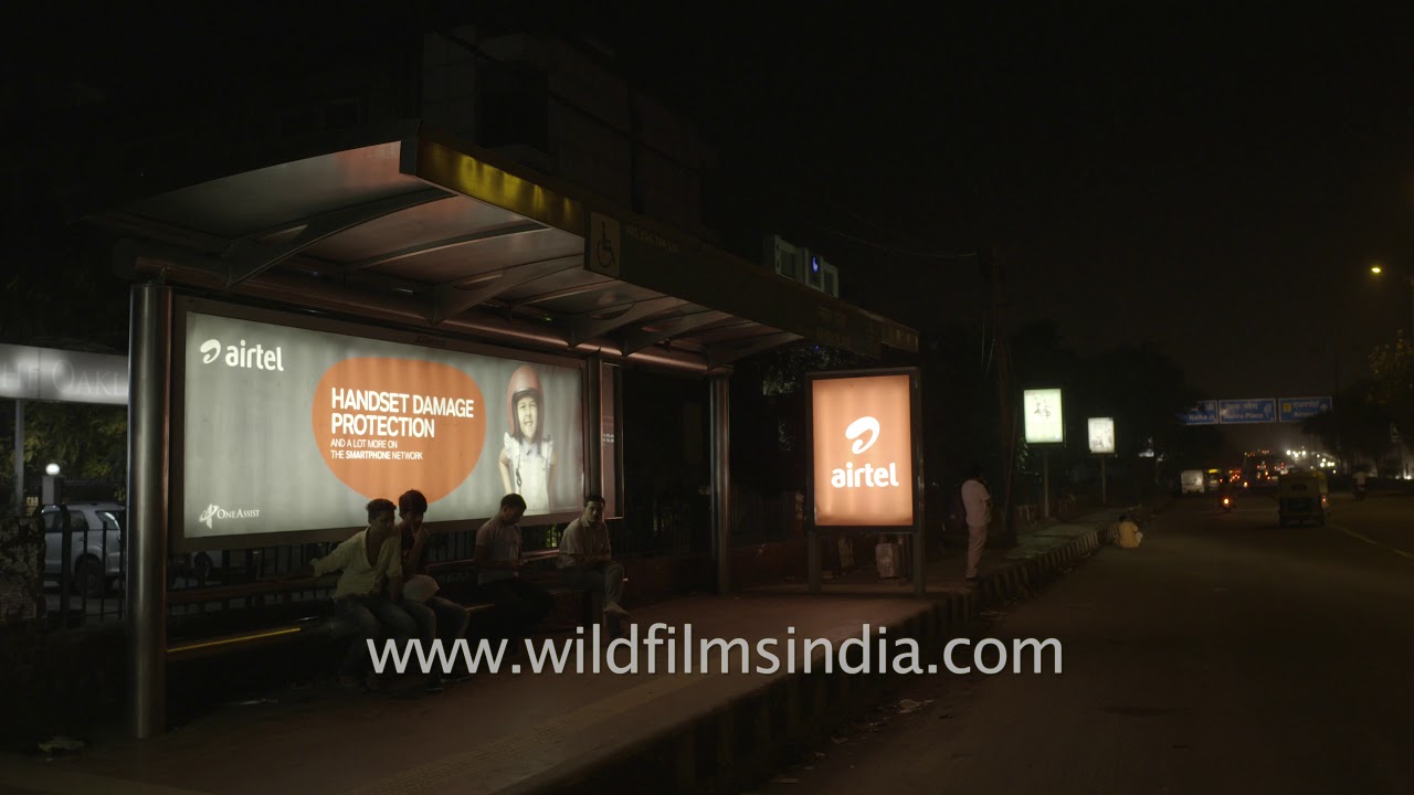 Traffic in fast motion near Nehru Place bus stand, New Delhi