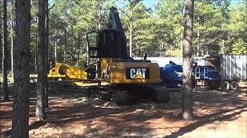 Cat 320D FM loading a chipper