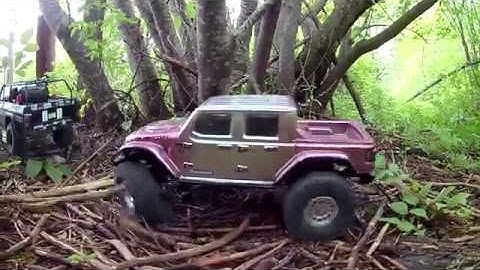 Redcat Gen 8 Axe & Axial Scx10 III crawling around the woods and lake.