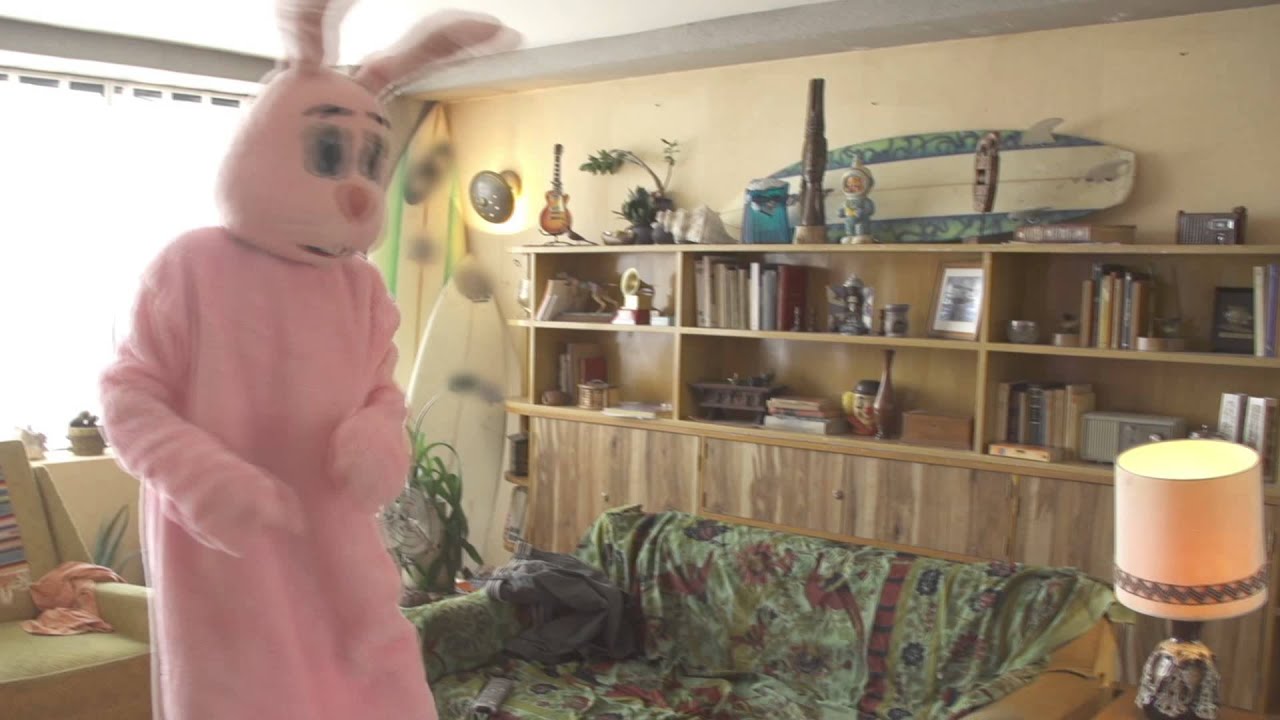 The Sims 4 - Social Bunny Soiree - A bearded man dancing in a pink bunny costume. An unlisted Easter egg from The Sims 4 trailer.