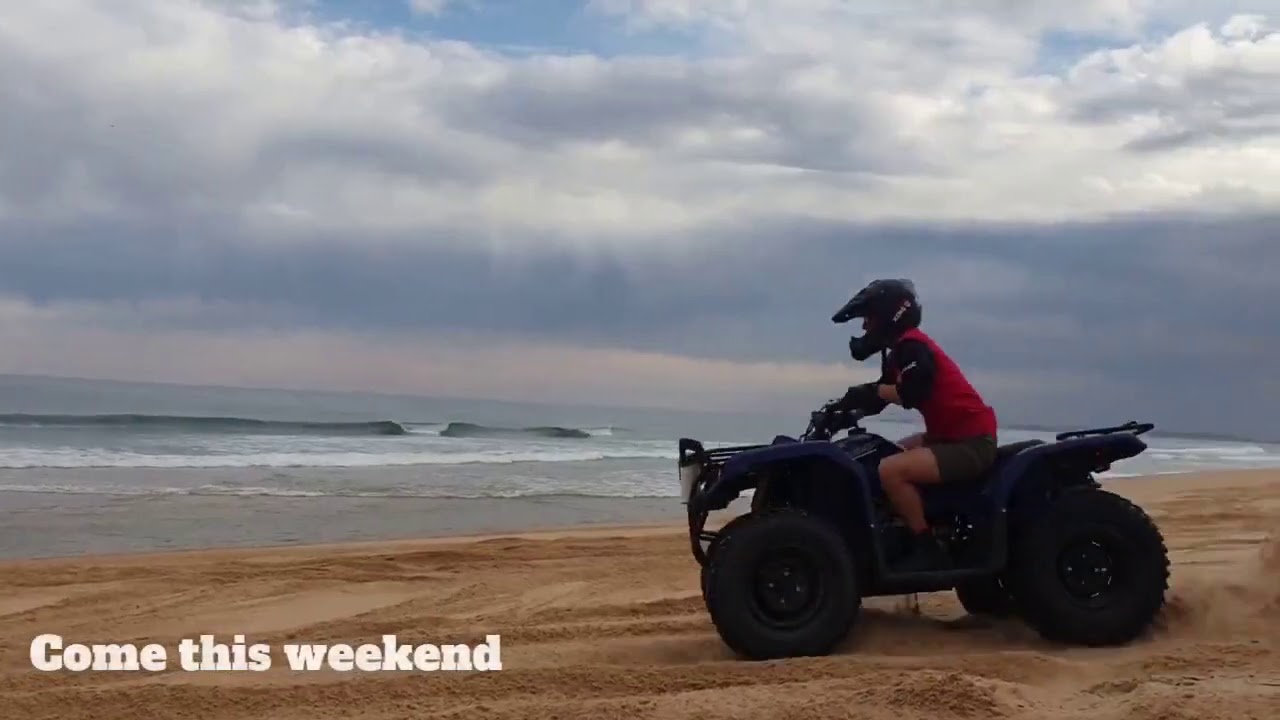 Girls can't resist a quad bike tour on Stockton Beach