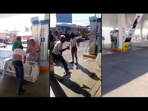 Presuntos normalistas vandalizan gasolinera y regalan gasolina y aceite al público en Tapachula.