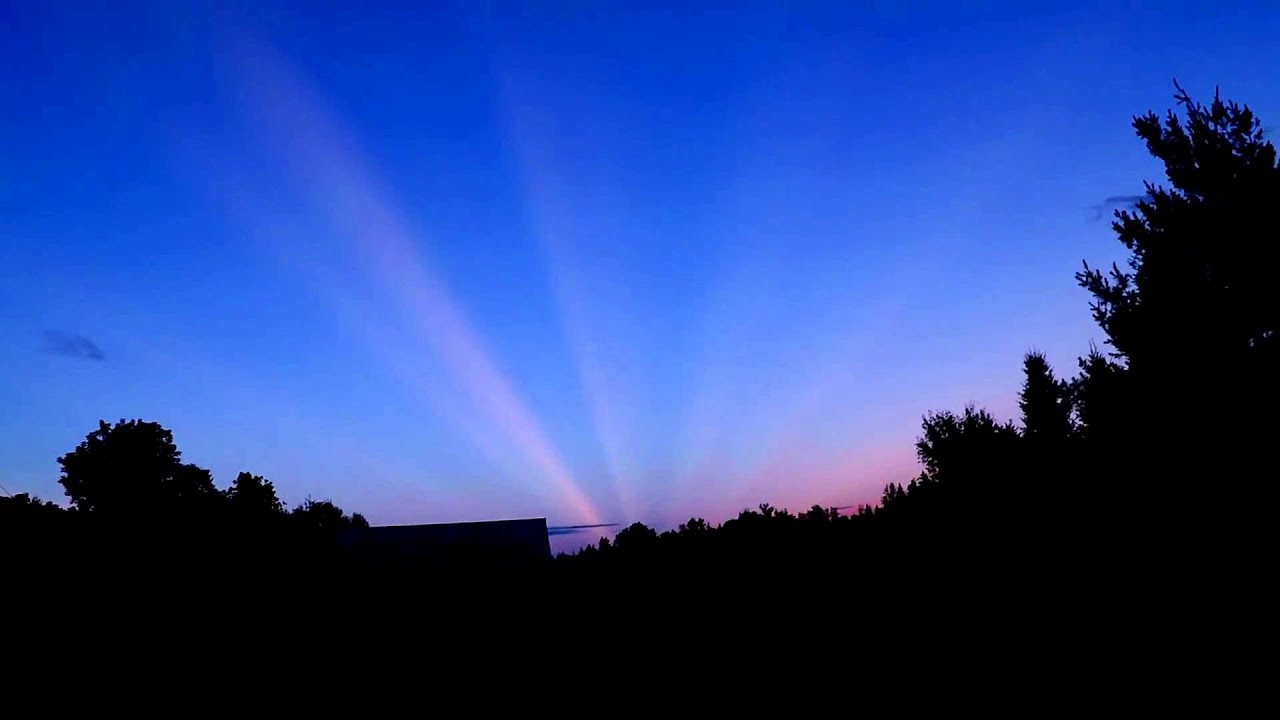 Rare sunlight rays streak across entire sky YouTube