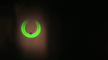 Trapping of absorbing particles with an optical bottle