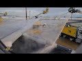 Much needed de-icing of airplane viewed from the inside of passenger cabin