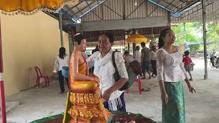 Climbing sugar palm tree and taking food to Wat Palang, deep fried pork on Cambodian New Year