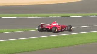 Ex Michael Schumacher Benetton and Ferrari F1 cars in action at Silverstone