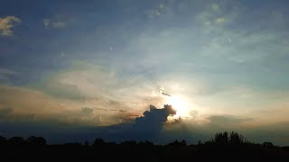 A shiny sunset behind the clouds time lapse, Relax in Nature with Cloud Observe