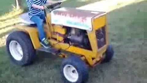Ethan driving  the cub cadet 123
