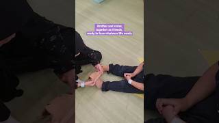 Sister Helping His Brother Wearing Socks