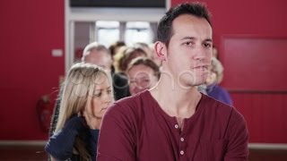 Long Queue Of People Waiting Patiently In Line. Stock Footage