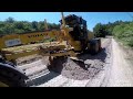 Motor Grader Grading The Edge And The Road-Skilled Operator