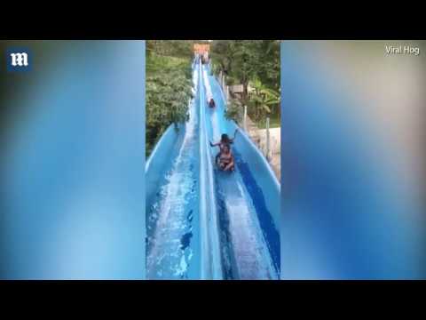 Woman torpedoes down water slide at Mexican water park"
