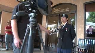 Soldier surprises mother at work.