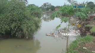 Belasan Makam Tergerus Banjir di Cisadane