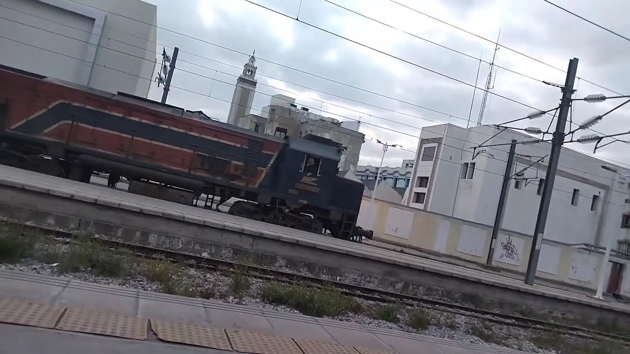 SNCFT: Two Trains 5/53 And 6/51 by Locomotive EMD GT Enter Station Tunis Then they Start their Trip